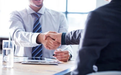 two businessmen shaking hands